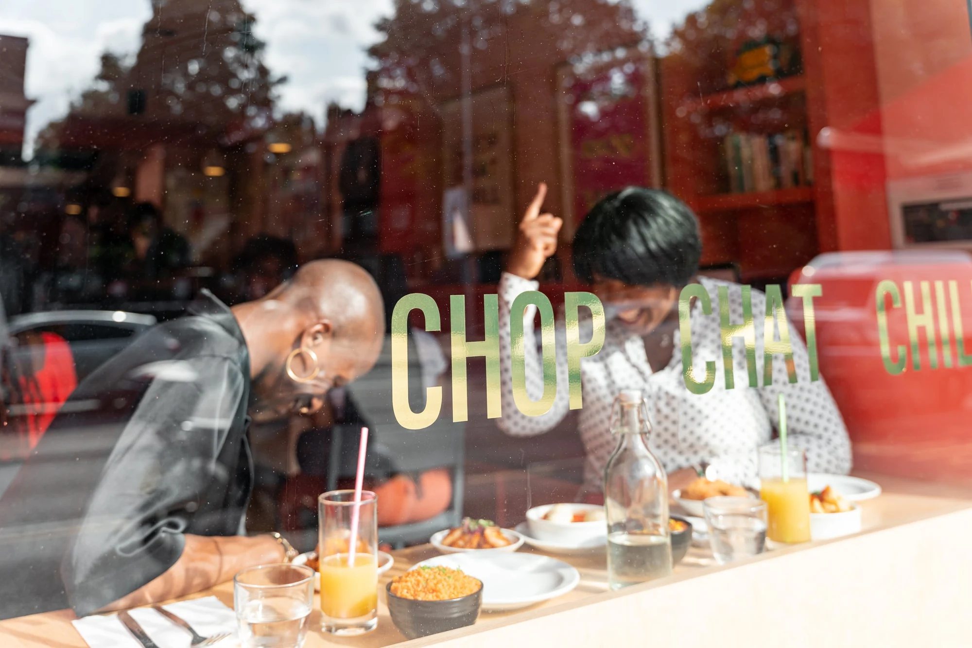 Friends enjoying weekend brunch in Chuku’s sunny window