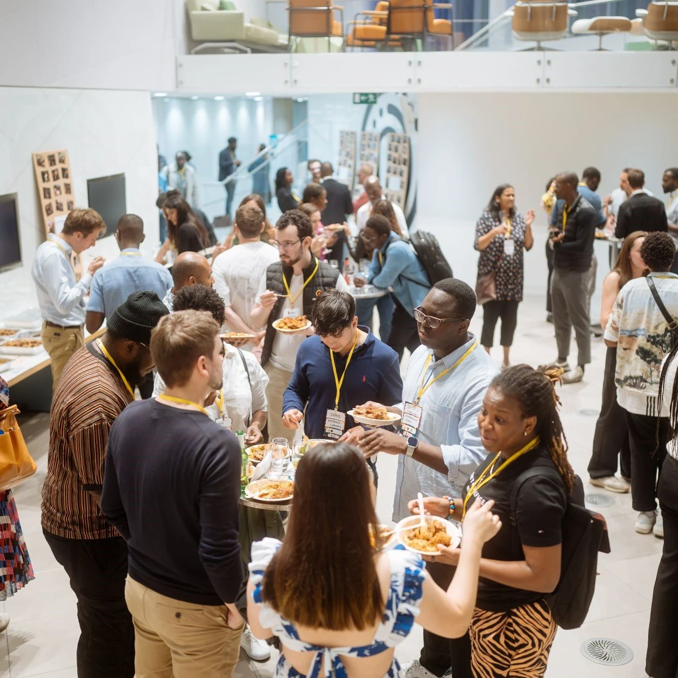 Guests chatting at a corporate event catered by Chuku’s
